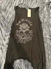 Stylish black sleeveless top with 'Namaste' and lotus design in gray.
