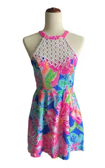 Lilly Pulitzer Gorgeous bright color floral dress, white crochet circles bodice, dress is fully lined, has pockets, hidden back zipper, excellent condition  Measurements:  Bust: armpit to armpit 16 inches  Waist: side to side 14 inches  Length: shoul