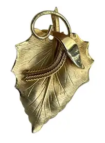 Vintage brooch maple leaf with fringe decor.