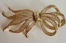 Monet Gold Tone Textured Metal Bow Fan Pin Brooch Signed