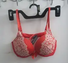 Victoria's Secret push-up lacey bottom bra with bow in middle in red and white size 32C.