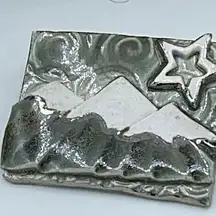 Artisan made ceramic mountain scene brooch