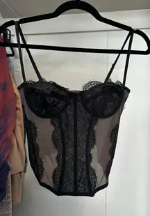 Out from under black corset lace top