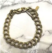 Monet gold tone vintage link bracelet with safety chain