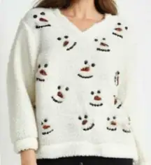  Embrace the winter season with this chic V-neck sweater featuring a delightful snowman design. Crafted for comfort and style, it's a perfect addition to your wardrobe.