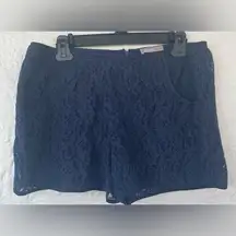 A Wear fully lined navy blue eyelet/lacy shorts with size zip and pockets; 12