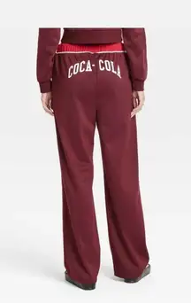Women's Coca-Cola Graphic Wide Leg Track Pants Size Small
🦋