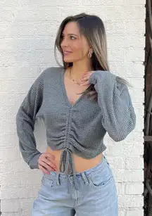 Grey green knit long sleeve top with drawstring detail sz s