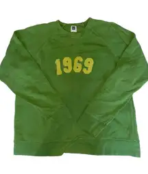 green and yellow embroidered “1969” crewneck