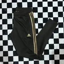 black and gold track joggers