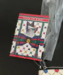 32. Brighton Holiday Love & Joy Pouch Crossbody Bag