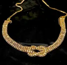 Crystal necklace with long solitaire chain. Double row of Ian odd other knot