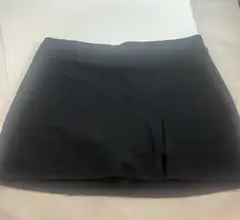 Urban Outfitters - black mini skort with front slit. Size small.