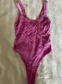 Out from under pink bodysuit