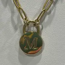 Gold tone paper clip necklace with‎ M charm