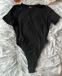 Black T-shirt Bodysuit in a size small 
Super soft material