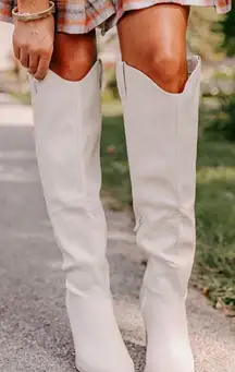 White knee high boots