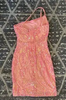 I’m selling a peachy dress. It’s one shoulder it’s a size small from