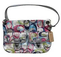 Coach . Multi-colored shoulder bag bag. Zip top closure