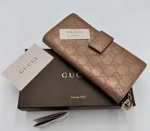 GUCCI
Metallic Guccissima Continental
Wallet Pink