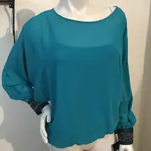 Gorgeous double layered sheer top with beaded cuff