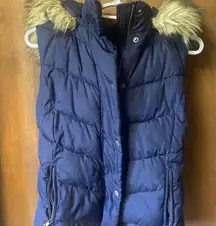 - Navy GAP puffer style vest with faux fur hood size small