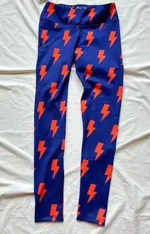 new without tags blue leggings ga with orange lightening bolts