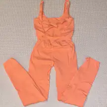 NEW! $98 FREE PEOPLE Movement Good Karma Onesie Neon Peach Coral XS/S