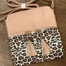 Leopard print cross body purses 9”x9”. Has a blush undertone.