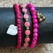 Set of 3 women’s‎ pink beaded charm bracelets OS stretches measurements shown
