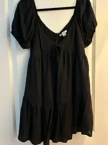 Black mini dress with puffy sleeves and tie front