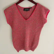 Short sleeved sweater. Color: tan and salmon. Size small.
