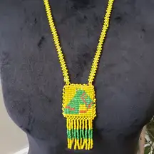 Vintage Womens Yellow Green Beaded Native American Medallion Tassel Necklace