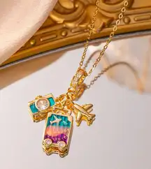Necklace, with camera, luggage and airplane pendant for women.