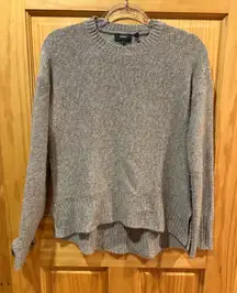 Theory knit crewneck sweater in various shades of brown and beige.