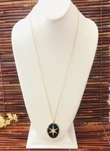 Oval Starburst Locket. Black with Gold Tone and Rhinestones. Long chain.