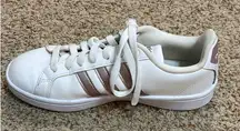 Rose gold and white Adidas tennis shoes
