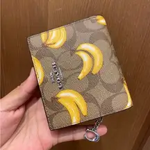 Coach  Snap Wallet In Signature Canvas With Banana Print