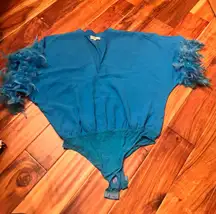 Women’s blue feather body suit.  brand. Size large