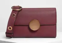 NWT Charles & Keith Burgundy Circular Push Lock Crossbody Bag