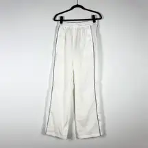 NEW Nike Women's Standard Fit High Rise Full Length Windbreaker Track Pants S