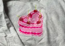 Skull House- Gray Sweatshirt with Pink Cake Design