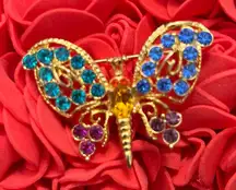 Elegant Gold Butterfly Brooch with Blue and Purple Accents