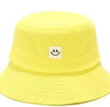 Bright yellow smiley face bucket hat