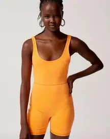 Urban Outfitters out from under large fluorescent neon Orange dive in singlet