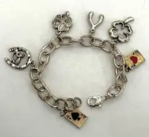 Silver tone lucky charm bracelet