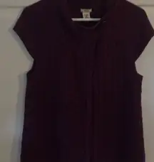 Izod woman's size large sweater vest.‎ Button at top. Rib cable knit.