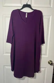 Plum colored, three-quarter length sleeve casual dress