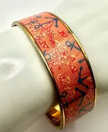 Lilly Pulitzer coral and gold tone nautical pattern bangle bracelet