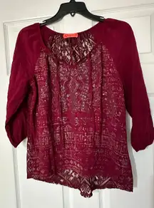 Spoiled quarter sleeve ladies blouse is a size small.